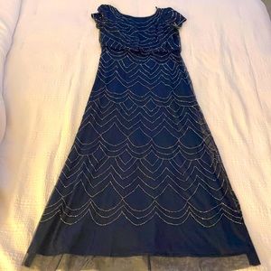 Dark blue long dress. Golden beads.